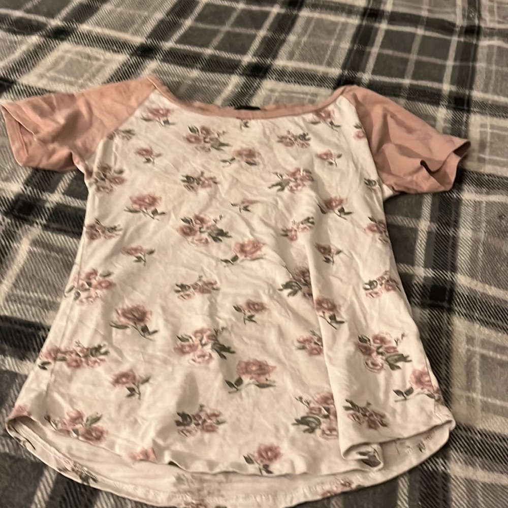 Pink and white T-shirt with flowers on it
